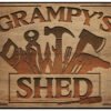 Grampys-Shed-metal-sign-with-tools-engraved-in-wood-effect