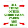 **Alt Text:** Funny rude Christmas card with bold green text reading "All These Other Christmas Cards Are Shit" surrounded by four red arrows pointing towards the message on a white background.