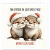 Otter Christmas card featuring two cute otters in Father Christmas hats, with “I’m Otterly in Love With You” and “Merry Christmas” on a cream background.