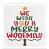 Merry Woofmas dog Christmas card with red, green and gold festive lettering, golden paw print, star and dog bone design on a textured white background.