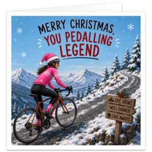 Female cyclist Christmas card showing a woman riding a road bike up a snowy mountain climb, wearing a bright pink cycling outfit and pink Santa hat. Snow-covered peaks, pine trees and falling snow create a festive winter scene. A wooden sign reads “EPIC VIEWS”, “WELL EARNED” and “CAKE AWAITS”. Large text across the top reads “MERRY CHRISTMAS, YOU PEDALLING LEGEND”.