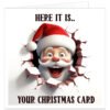 Funny Christmas card featuring a cheerful cartoon Santa Claus bursting through a cracked wall with a playful 3D effect. Front text reads "HERE IT IS.. YOUR CHRISTMAS CARD". Blank inside, professionally printed on premium 300gsm matte cardstock with envelope included.