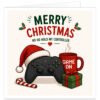 Funny gamer Christmas card with the text “Merry Christmas” and “Ho Ho Hold My Controller”. Festive illustration features a black games controller wearing a red Santa hat beside a red “Game On” mug, green Christmas present, candy cane and holly with berries. Red and green typography and pixel-style heart details complete this cheerful gaming Christmas card for male and female video game fans of all ages.