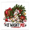 Funny cat Christmas card featuring a mischievous tabby kitten wearing a red Santa hat and tangled in colourful festive lights, sitting amongst fallen Christmas tree branches, broken baubles, scattered decorations and presents. Text reads “IT WASN’T ME”, creating a humorous festive design for cat mums, cat dads, cat owners and cat lovers.