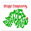 Northern Ireland Christmas card featuring a green map silhouette with Northern Ireland lettering, red Merry Christmas text and a festive Santa hat.