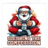 Funny gaming Christmas card featuring a determined Santa Claus in a red suit and hat, wearing a gaming headset and gripping a games controller. Colourful comic-style artwork uses bold red, orange and blue tones with action lines and gaming graphics. Large distressed text below Santa reads “SLEIGHING THE COMPETITION”, creating a festive gaming pun for male and female gamers of all ages.