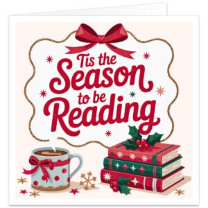 Book lover Christmas card on a soft cream background featuring the festive message “’Tis the Season to be Reading” in flowing red lettering. A large red bow and wavy gold border frame the text, with gold snowflakes and stars around the design. At the bottom, a steaming festive mug sits beside a stack of red and green books decorated with snowflakes, stars, holly and red berries. Cosy Christmas card for readers and bookworms.