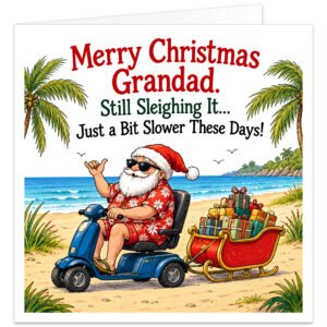 Funny Grandad Christmas card featuring the message "Merry Christmas Grandad. Still Sleighing It… Just a Bit Slower These Days!" Colourful illustration of an elderly Santa Claus wearing sunglasses, a red Hawaiian shirt, shorts and Santa hat, riding a blue mobility scooter along a tropical beach. He gives a thumbs-up while towing a miniature red sleigh filled with Christmas presents. Palm trees, golden sand and turquoise sea complete this humorous festive design on a white background.